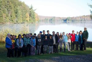 students and staff pose lakeside at the Haliburton Forest Reserve during a team-building experience organized by King’s College School, a private school serving students in the Caledon, Brampton, Orangeville and Bolton areas.