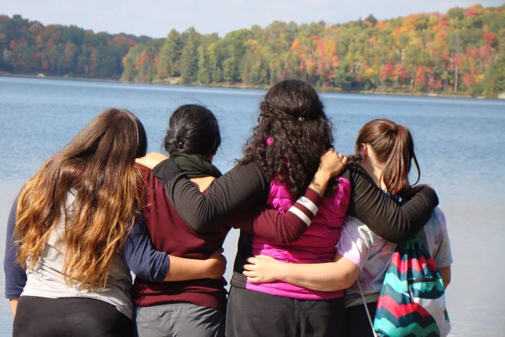 students taking in the lake view at the Haliburton Forest Reserve during a team-building experience organized by King’s College School, a private school serving students in the Caledon, Brampton, Orangeville and Bolton areas.